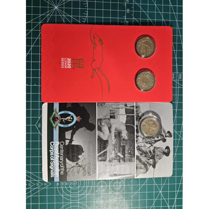 Carded $1- coins lunar, royal aus corps