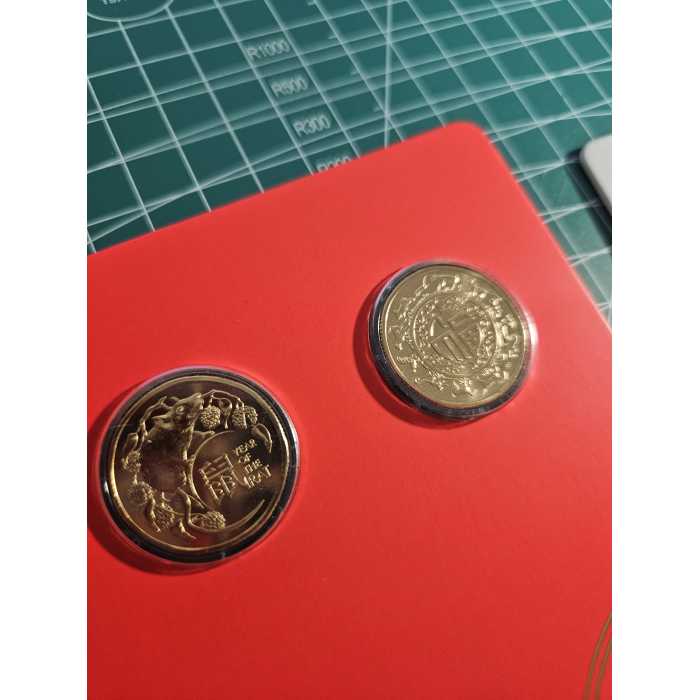 Carded $1- coins lunar, royal aus corps