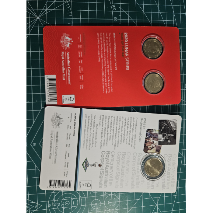 Carded $1- coins lunar, royal aus corps