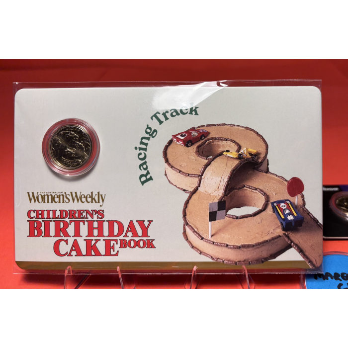 2025 Aus Women’s Weekly Birthday Cake Book - $1 Racing Track Carded Coin 